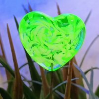 Uranium vasoline glass heart plant pick with white swirls on 5in wire. Use for floral bouquet, plants, jewelry, gifts; handmade by me; 395nm