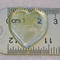 My Wispy Heart Glows! Uranium Large Heart  1" (25mm) clear glass with uranium swirls; This pocket heart is perfect for gift or curio display