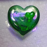 My Green Heart Glows! Uranium Large Heart 1.125" (25mm) sage green glass with uranium swirls; this pocket heart is perfect for gift or curio