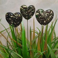 Uranium vasoline glass heart plant pick with black swirls on 5in wire. Use for floral bouquet, plants, jewelry, gifts; handmade by me; 395nm