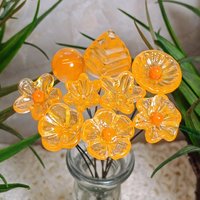Tangerine glass flowers on wire headpins; juicy mix of clear and orange. Handcraft lampwork: jewelry, gifts, wedding, bouquets, mixed media