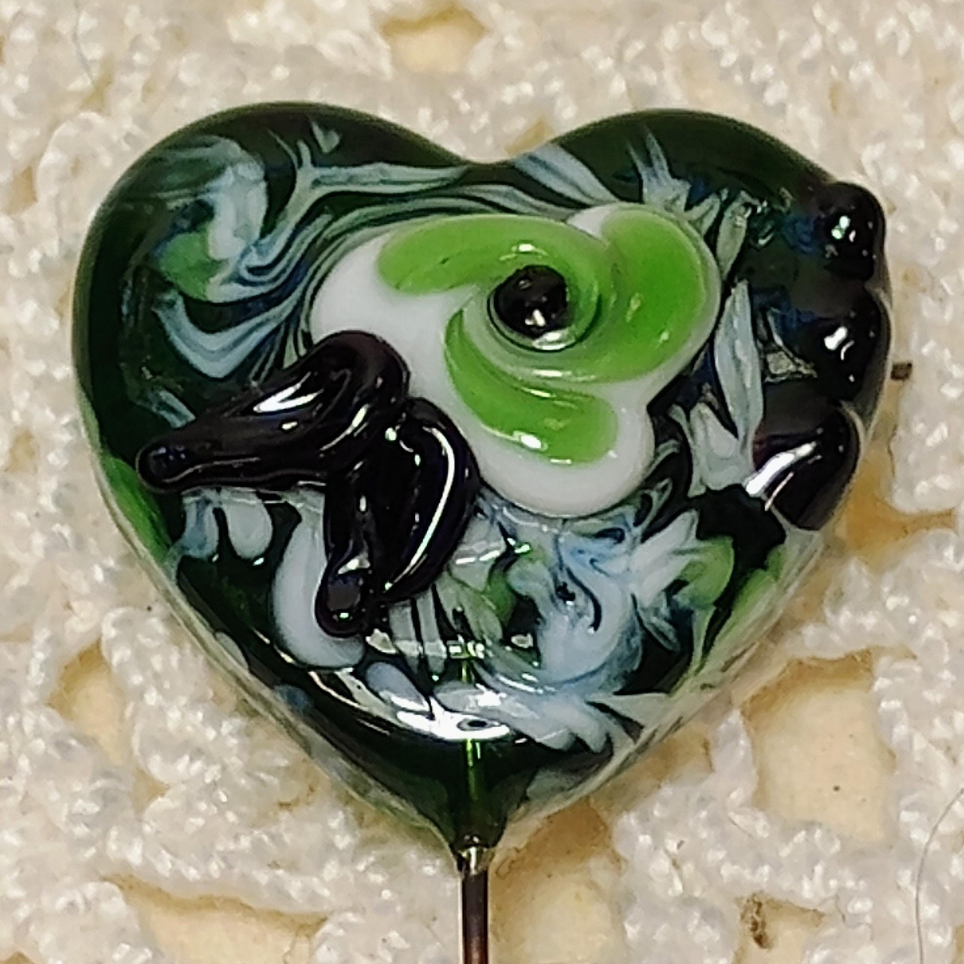 Glass Heart Plant Pick: Green/White with Swirled Flower, 3/4in x 3/4in on 5in wire. Floral bouquet, plants, jewelry, gifts; each unique