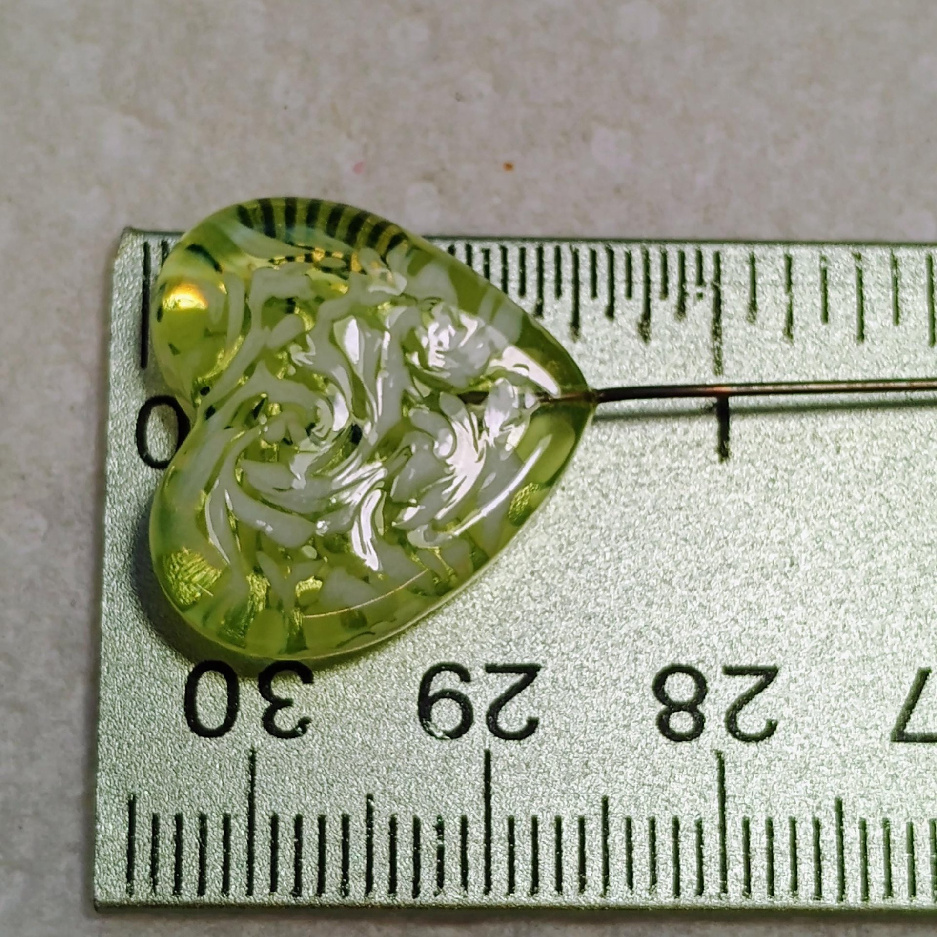 Uranium vasoline glass heart plant pick with white swirls on 5in wire. Use for floral bouquet, plants, jewelry, gifts; handmade by me; 395nm