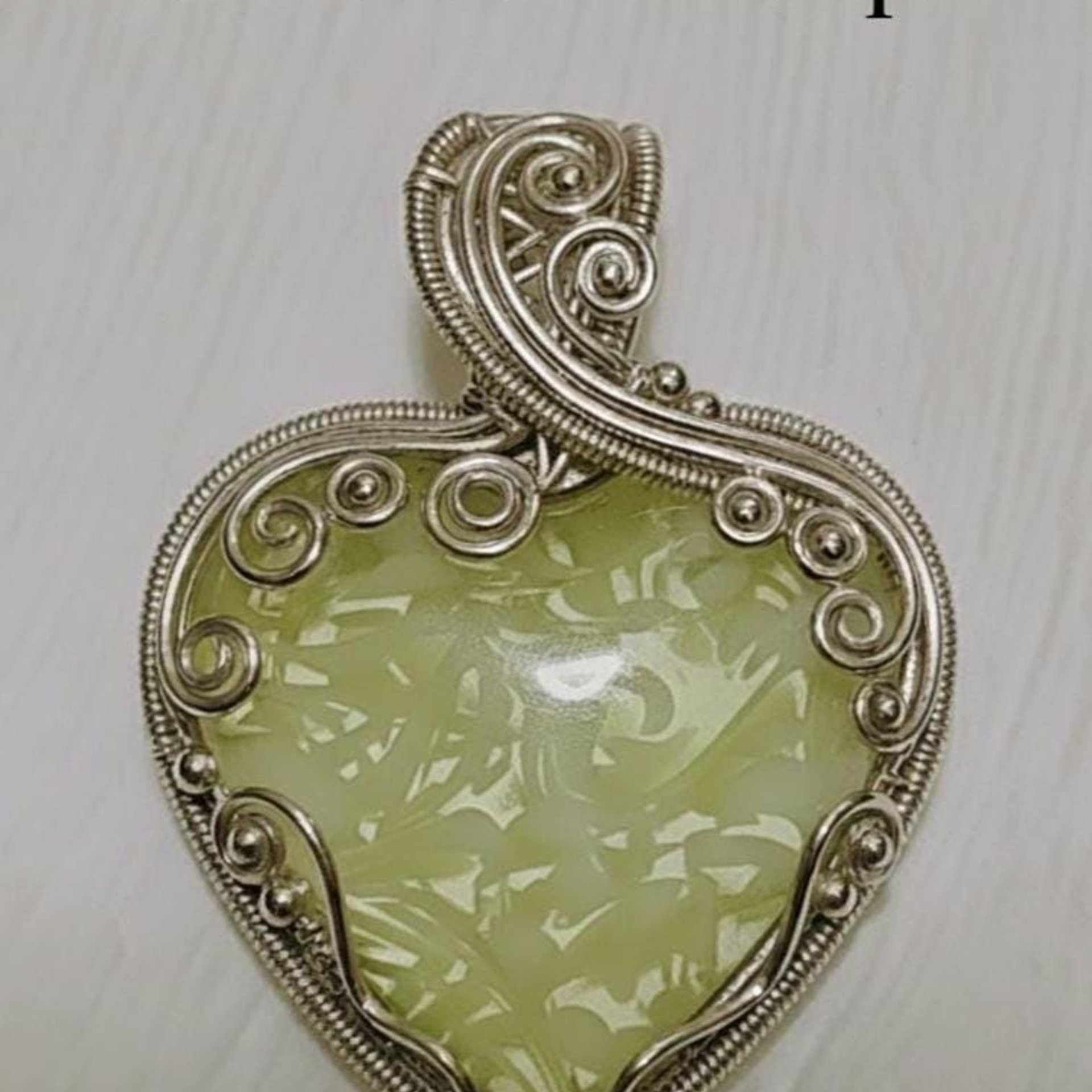My Heart Glows! Uranium Small Heart  3/4in, vasoline glass with white swirls. lampwork pocket heart, cabachon, wire wrapping, jewelry, curio
