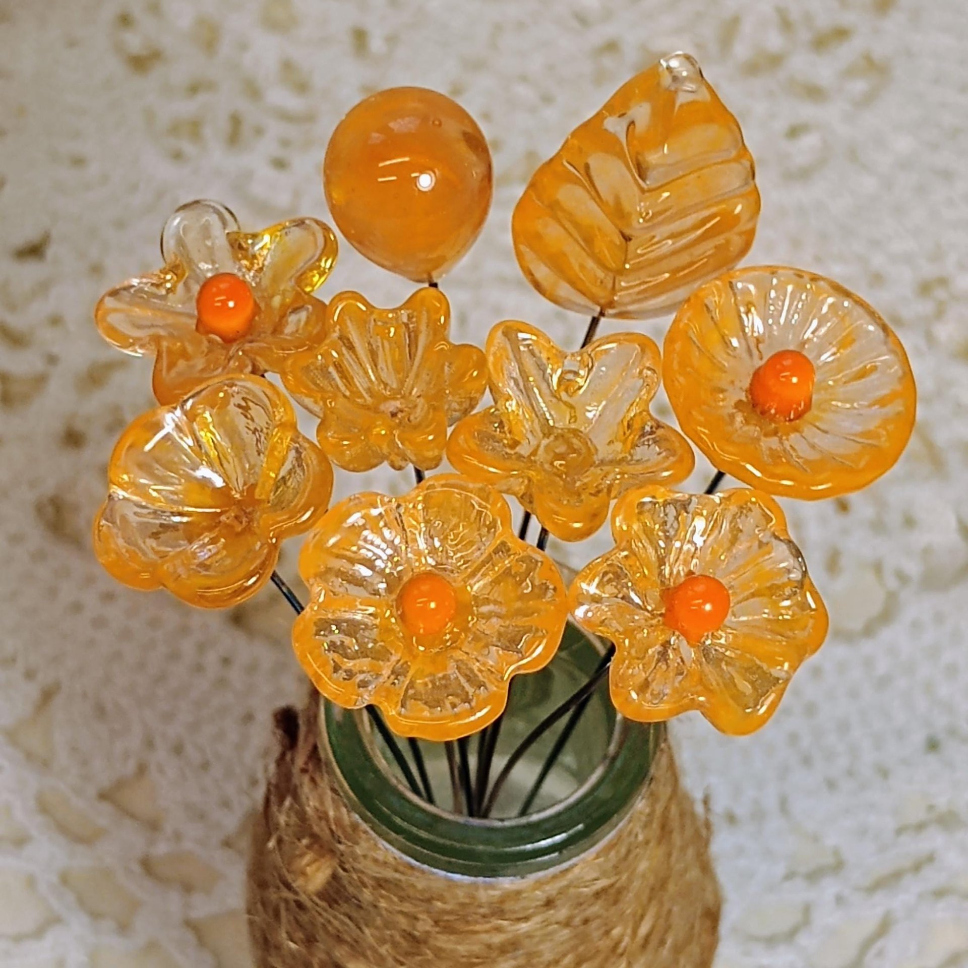 Tangerine glass flowers on wire headpins; juicy mix of clear and orange. Handcraft lampwork: jewelry, gifts, wedding, bouquets, mixed media