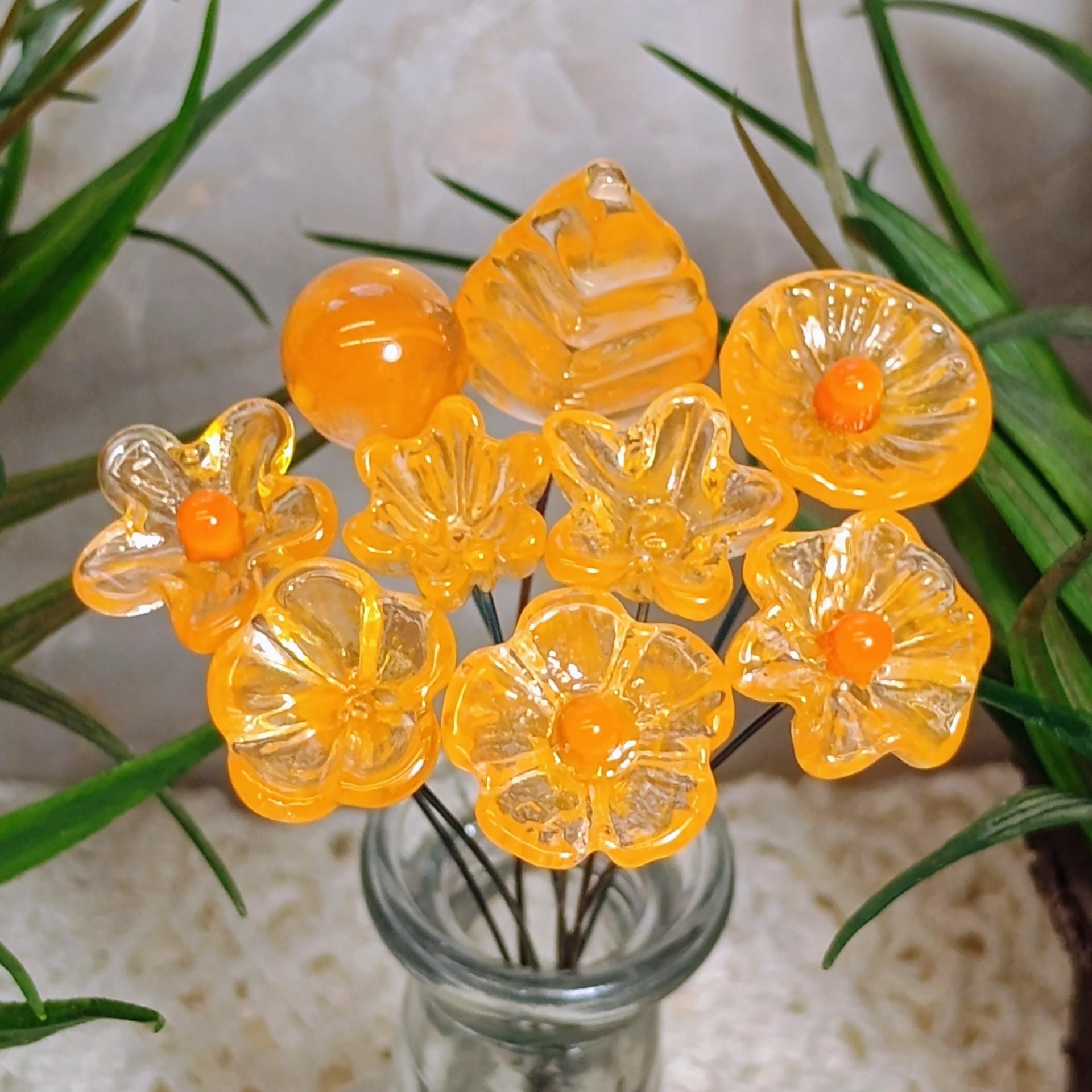 Tangerine glass flowers on wire headpins; juicy mix of clear and orange. Handcraft lampwork: jewelry, gifts, wedding, bouquets, mixed media
