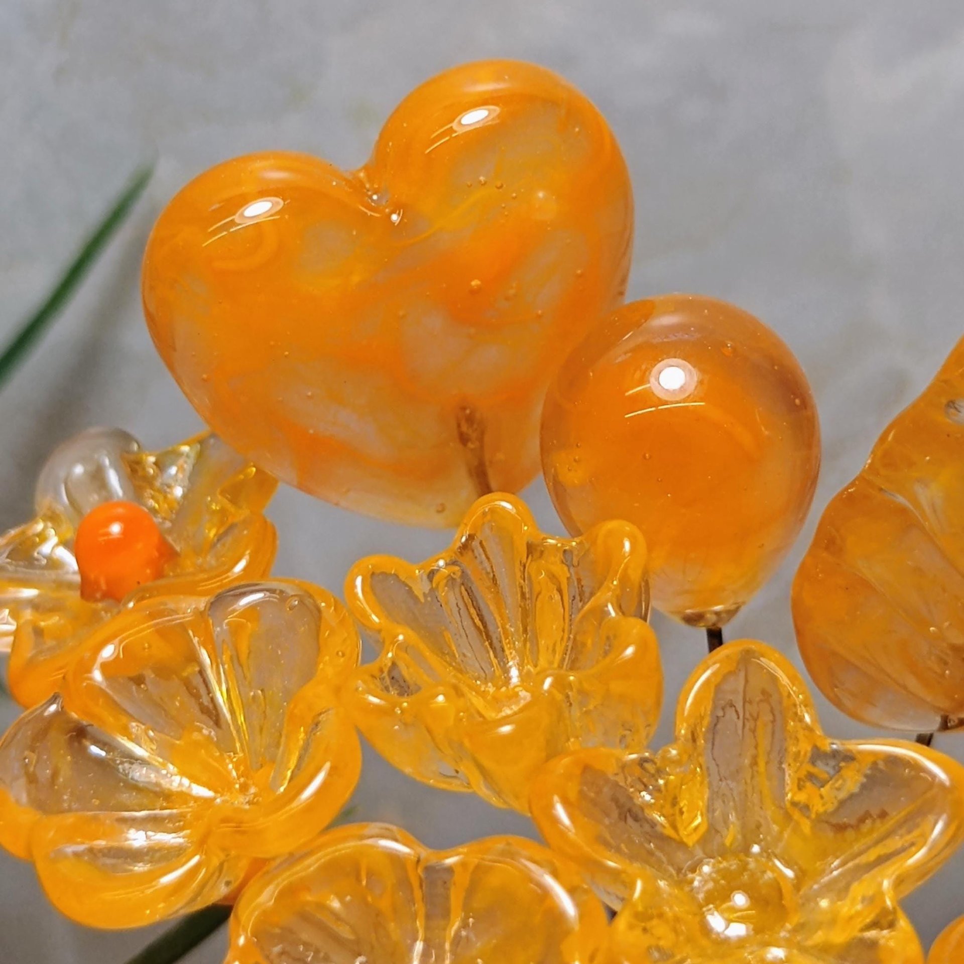 Tangerine glass flowers on wire headpins; juicy mix of clear and orange. Handcraft lampwork: jewelry, gifts, wedding, bouquets, mixed media