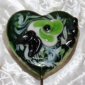 Glass Heart Plant Pick: Green/White with Swirled Flower, 3/4in x 3/4in on 5in wire. Floral bouquet, plants, jewelry, gifts; each unique