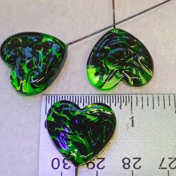 Uranium vasoline glass heart plant pick with black swirls on 5in wire. Use for floral bouquet, plants, jewelry, gifts; handmade by me; 395nm