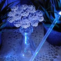 Clear Crystal Lead 365 UV reactive glass flowers; mini tiny small glass flowers on wire; soft blue glow under uv 365nm light