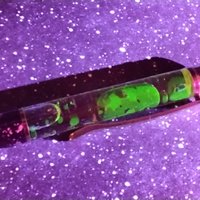 Alien Spit Slime Goo Ink Pen -proof that aliens do exist! UV glow, uranium glow radioactive, slime filled ink pen with cosmic design LIMITED