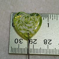 Uranium vasoline glass heart plant pick with white swirls on 5in wire. Use for floral bouquet, plants, jewelry, gifts; handmade by me; 395nm