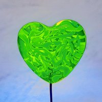 Uranium vasoline glass heart plant pick with white swirls on 5in wire. Use for floral bouquet, plants, jewelry, gifts; handmade by me; 395nm