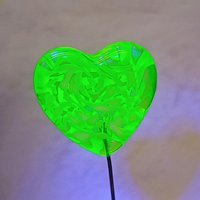 Uranium vasoline glass heart plant pick with white swirls on 5in wire. Use for floral bouquet, plants, jewelry, gifts; handmade by me; 395nm
