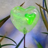 Wispy uranium vasoline glass on clear heart plant pick on 5in wire. Use for floral bouquet, plants, jewelry, gifts; handmade; 395nm