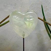 Wispy uranium vasoline glass on clear heart plant pick on 5in wire. Use for floral bouquet, plants, jewelry, gifts; handmade; 395nm