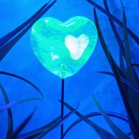 Wispy uranium vasoline glass on clear heart plant pick on 5in wire. Use for floral bouquet, plants, jewelry, gifts; handmade; 395nm