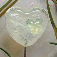 Wispy uranium vasoline glass on clear heart plant pick on 5in wire. Use for floral bouquet, plants, jewelry, gifts; handmade; 395nm