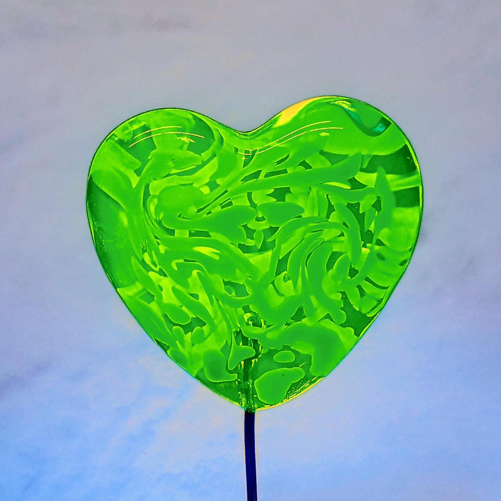Uranium vasoline glass heart plant pick with white swirls on 5in wire. Use for floral bouquet, plants, jewelry, gifts; handmade by me; 395nm